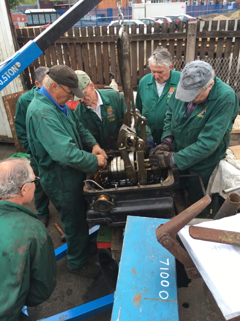 Jim (2nd right) involved in the Caprotti box disassembly)